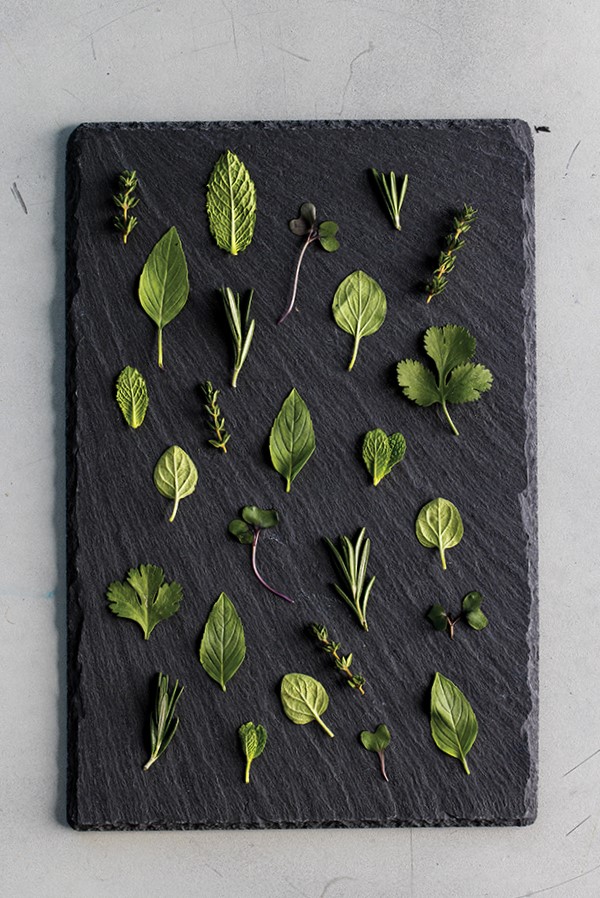 Herbs on cutting board.
