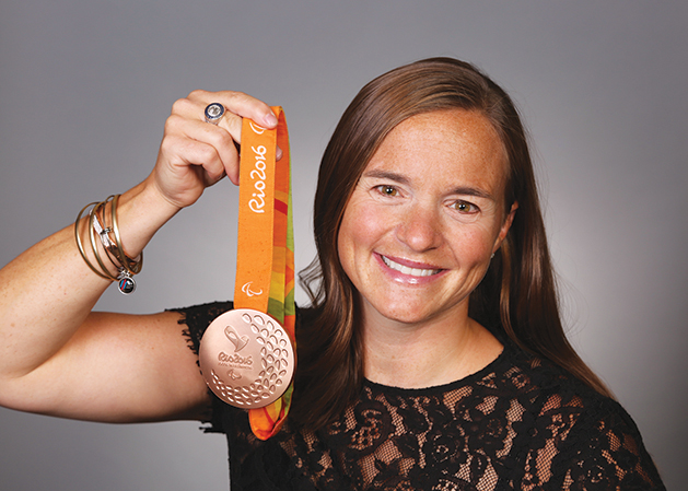 U.S. veteran and Paralympian Melissa Stockwell holding medal