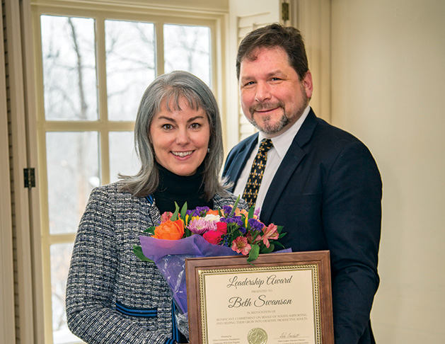 Beth Swanson receives her Connecting with Kids award from the Edina Community Foundation