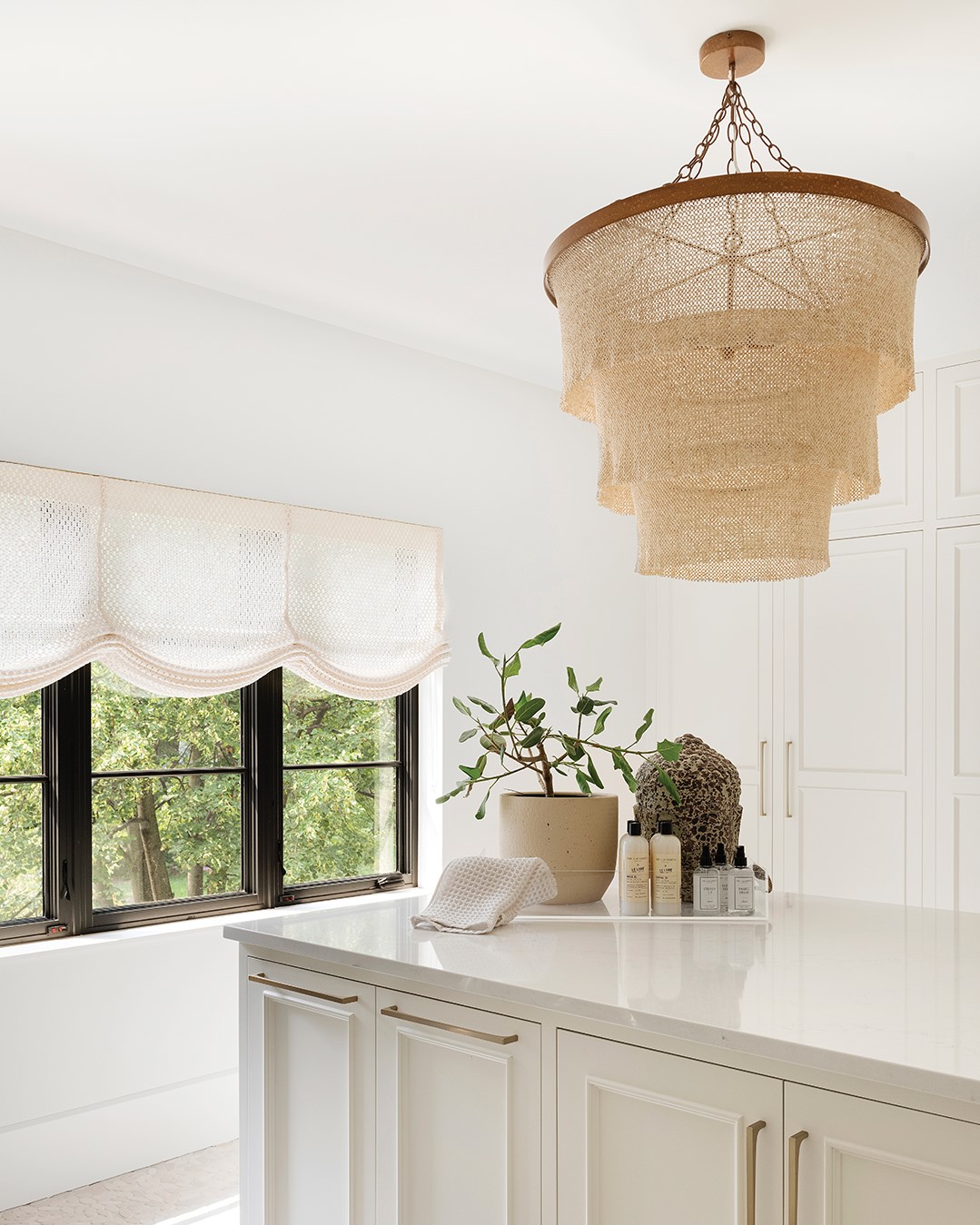 A woven chandelier is an example of texture in statement lighting.