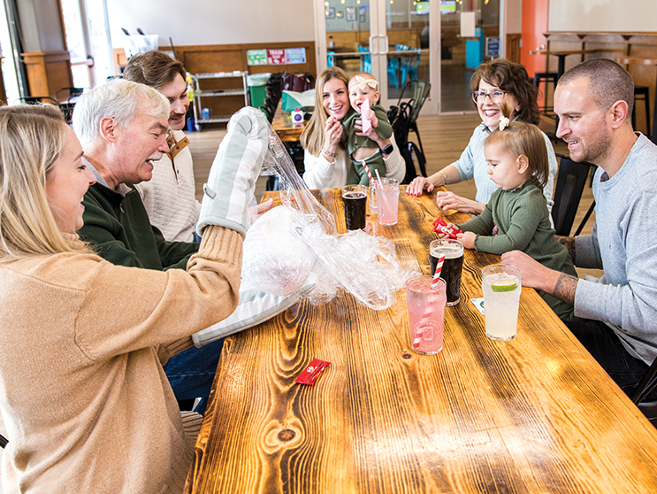 The Swanke family plays the Saran Wrap-ball game at Wooden Hill Brewery. The game has been a tradition since the 1990s.
