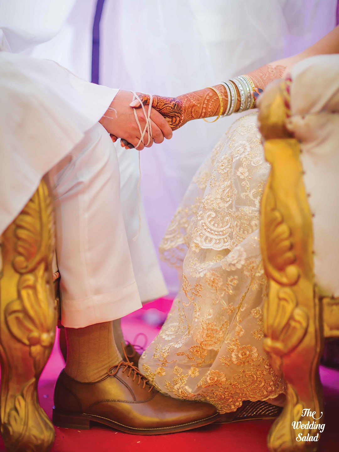 Payal holds the hand of her husband, Rohan Moradian, during the Ara Antar portion of their Indian Zoroastrian wedding. Their hands are joined by seven (an auspicious number in the religion) loops of a sacred thread. Payal’s story, A Confluence of Fates, takes place at a Zoroastrian wedding. 
