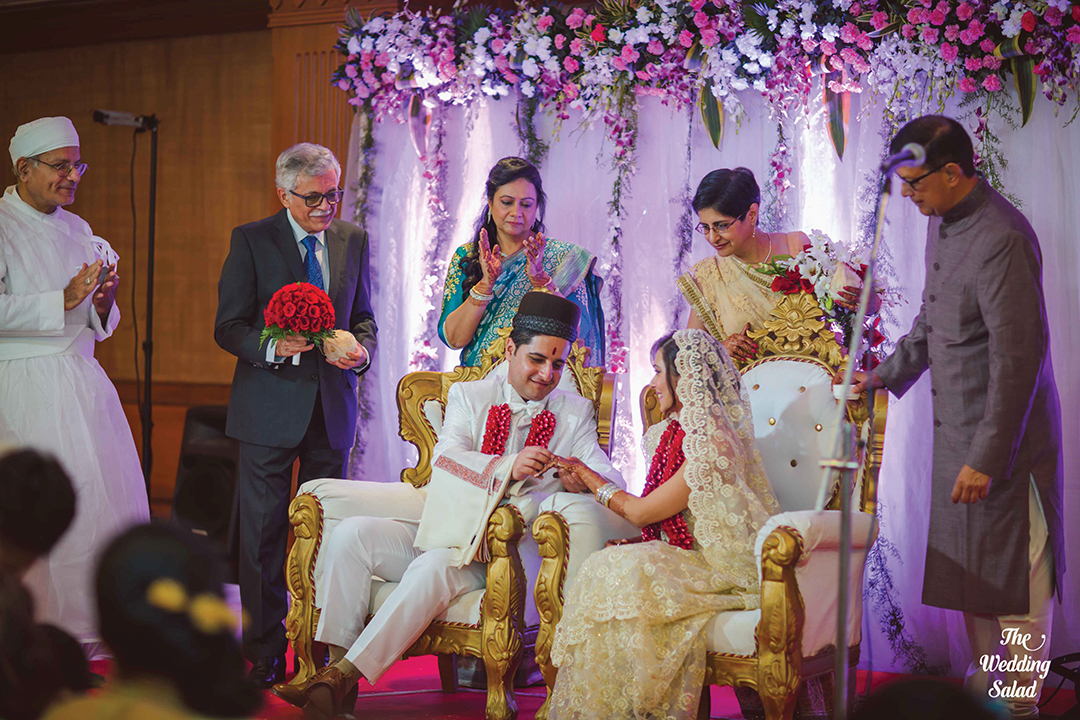 Rohan and Payal exchange rings under the loving gaze of their parents. 