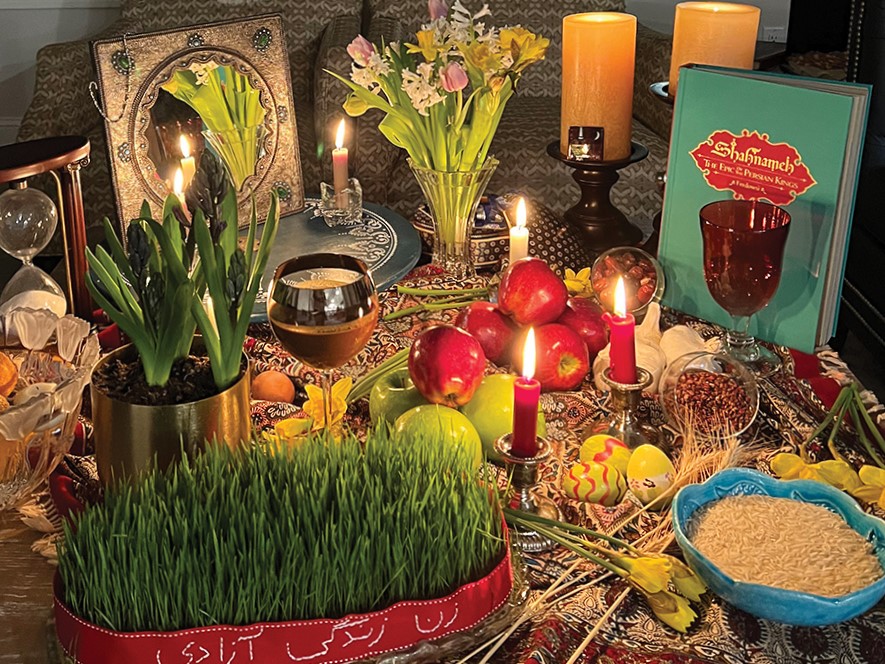 A Noruz table features seven items that start with the Persian letter for S. Sabzeh (wheatgrass), Samanu (wheat germ pudding), Senjed (dried oleaster), Seer (garlic), Seeb (apple), Sumac (crushed spice) and Serkeh (vinegar).