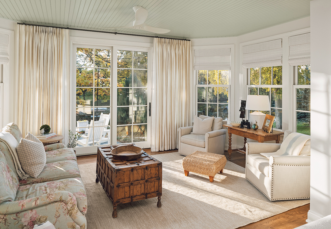 New window treatments and a beadboard Palladian blue ceiling help this sunroom to shine. The designer’s goal was to make the room lighter and brighter.