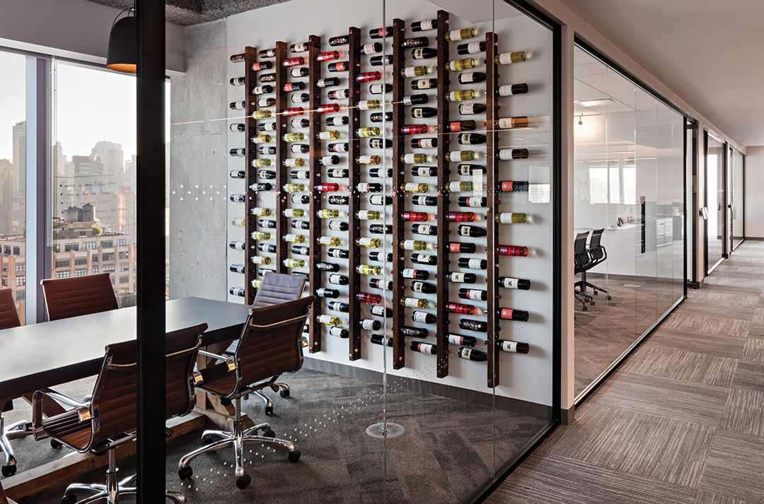 Using a wine rack as an art piece at Vayner Media in New York.