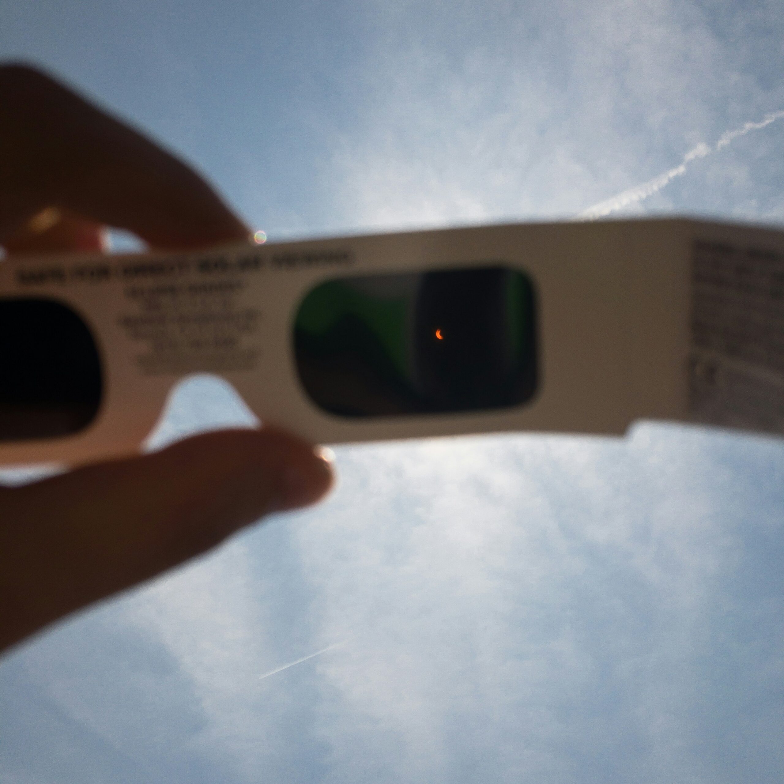 Man Holding Solar Eclipse Glasses