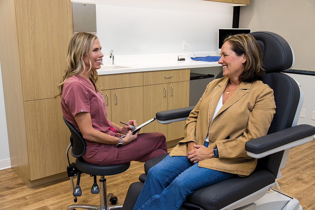 Betsy Johnson and Meredith Baker, M.D., having a consult at Minnesota Ophthalmic Plastic Surgery Specialists (MOPSS).