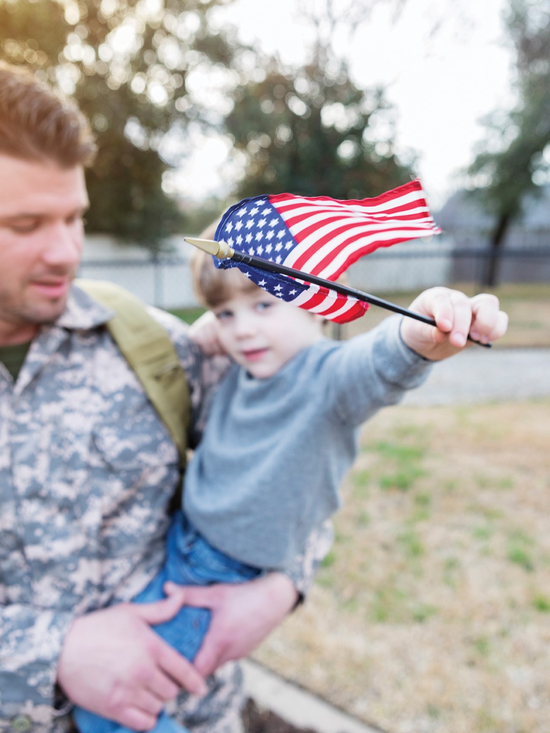 Veteran father holding his son