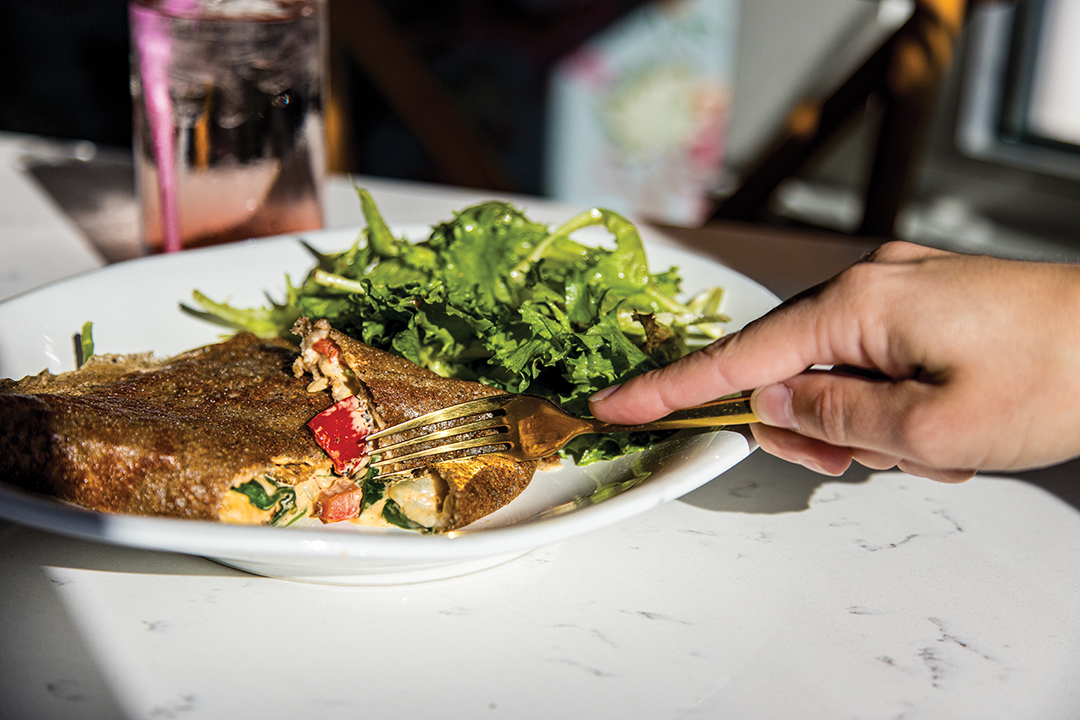 The Roasted Bell Pepper is one of the many savory crêpes on the menu. It features cheddar, roasted bell pepper caramelized onions, tomatoes, spinach and chipotle mayo. 