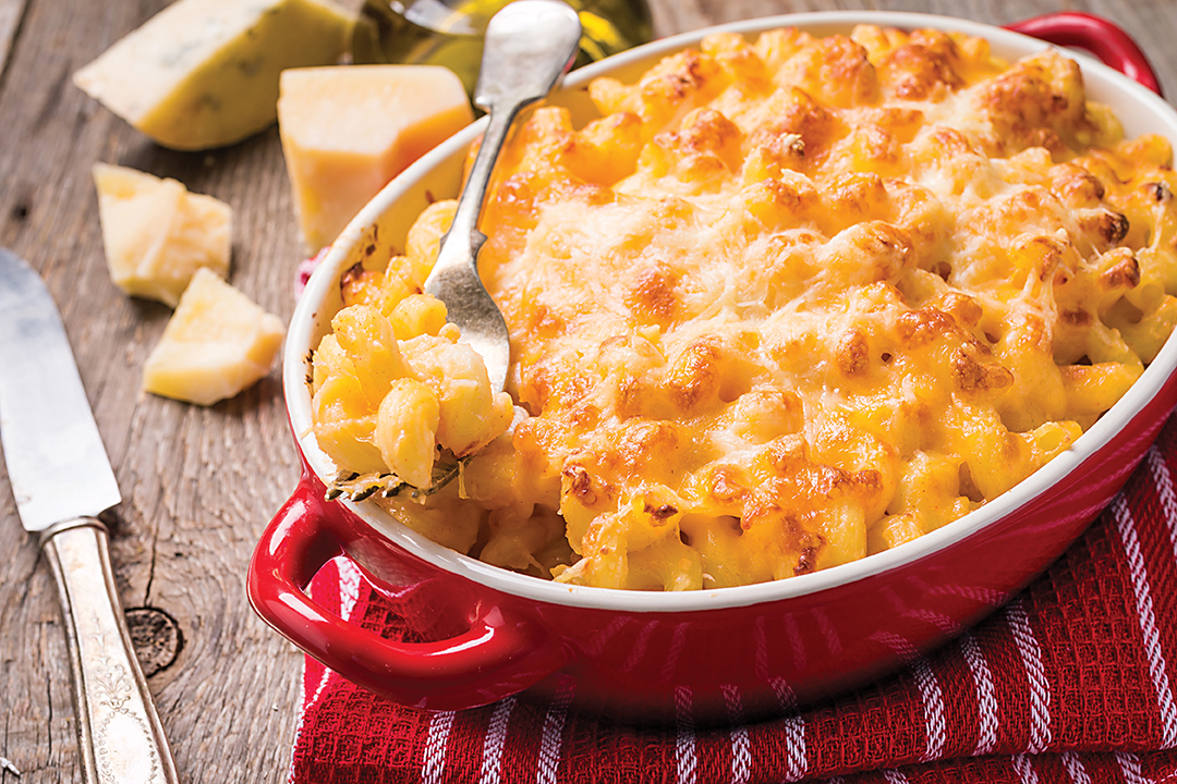 Mac and cheese, american style macaroni pasta in cheesy sauce