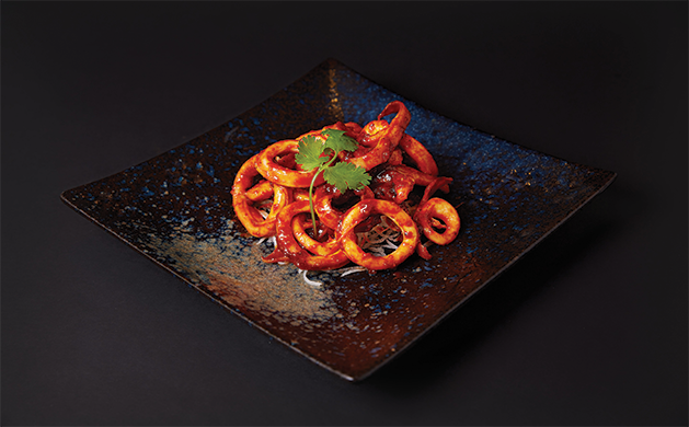 Spicy Kimchee Squid from Raku offers exotic Asian fusion flavors.