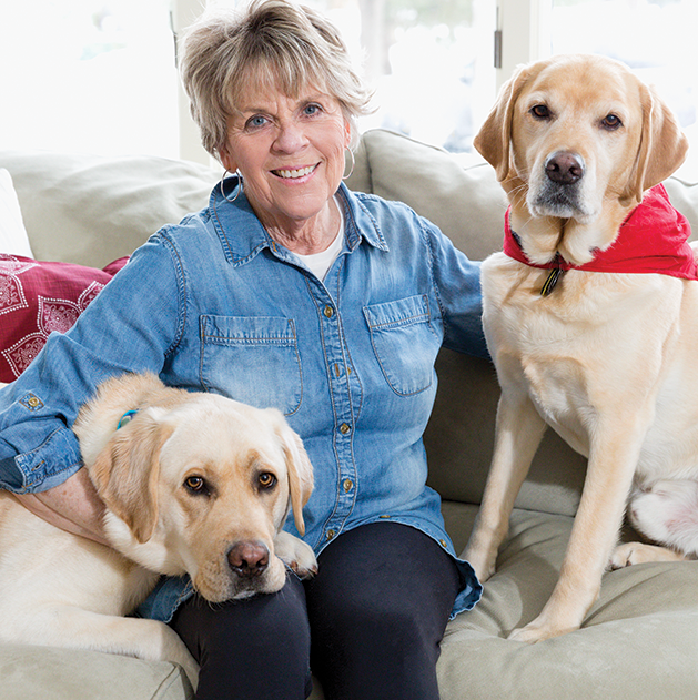 Barb Verhague and her trained therapy dogs Eddy and Sully.