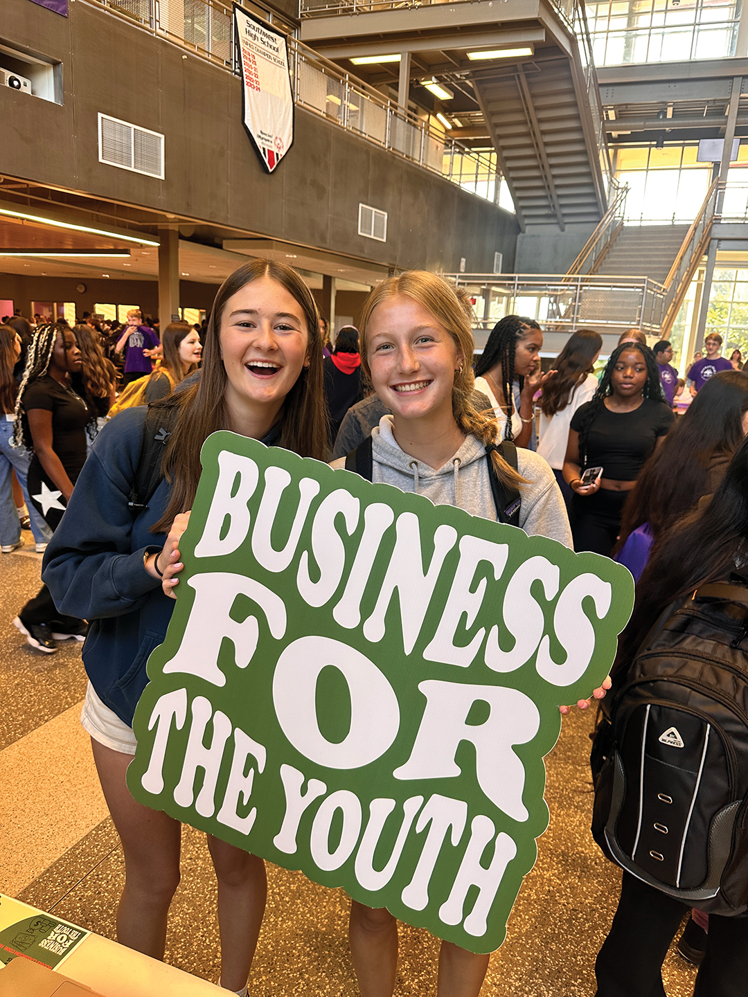 : Southwest High School students proudly hold up a giant version of BFTY’s logo.