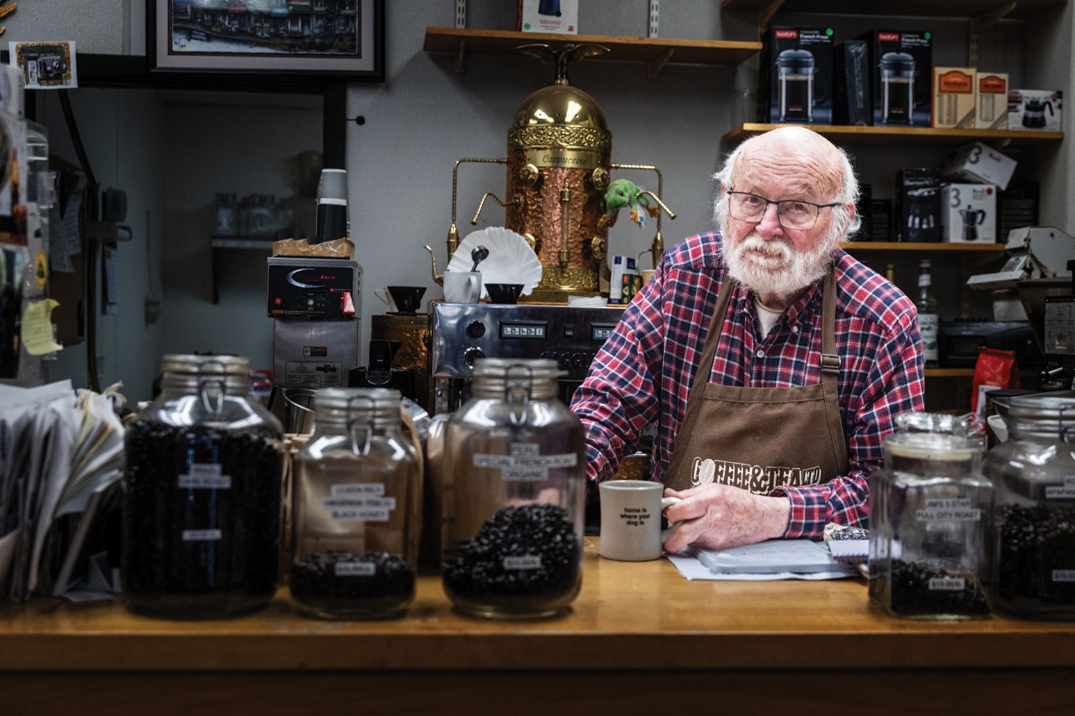 Jim Cone behind the counter of Coffee & Tea Ltd.