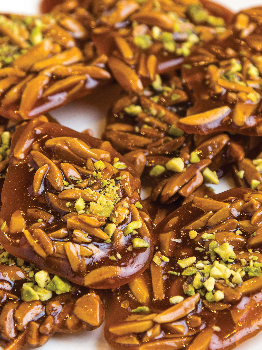 Saffron honey candy, sohan asali, is made with almonds, honey, rosewater, saffron and topped with crushed pistachios.