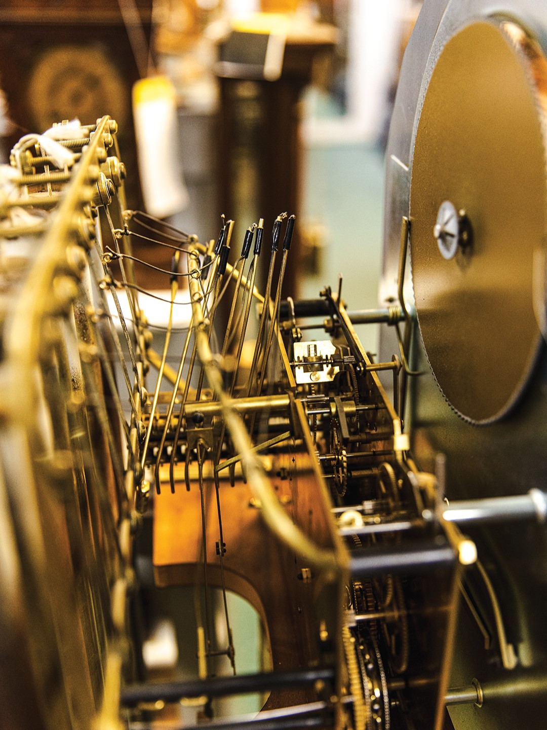 The intricate mechanical movement of a grandfather clock.
