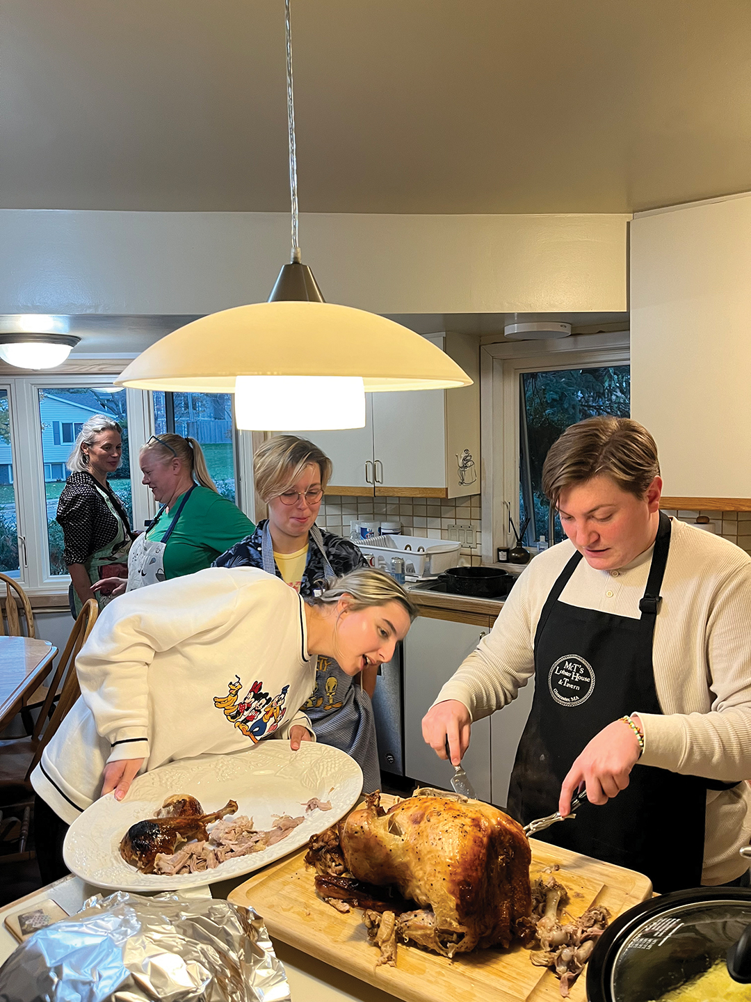 Alexandre Belvire carving the Thanksgiving Turkey
