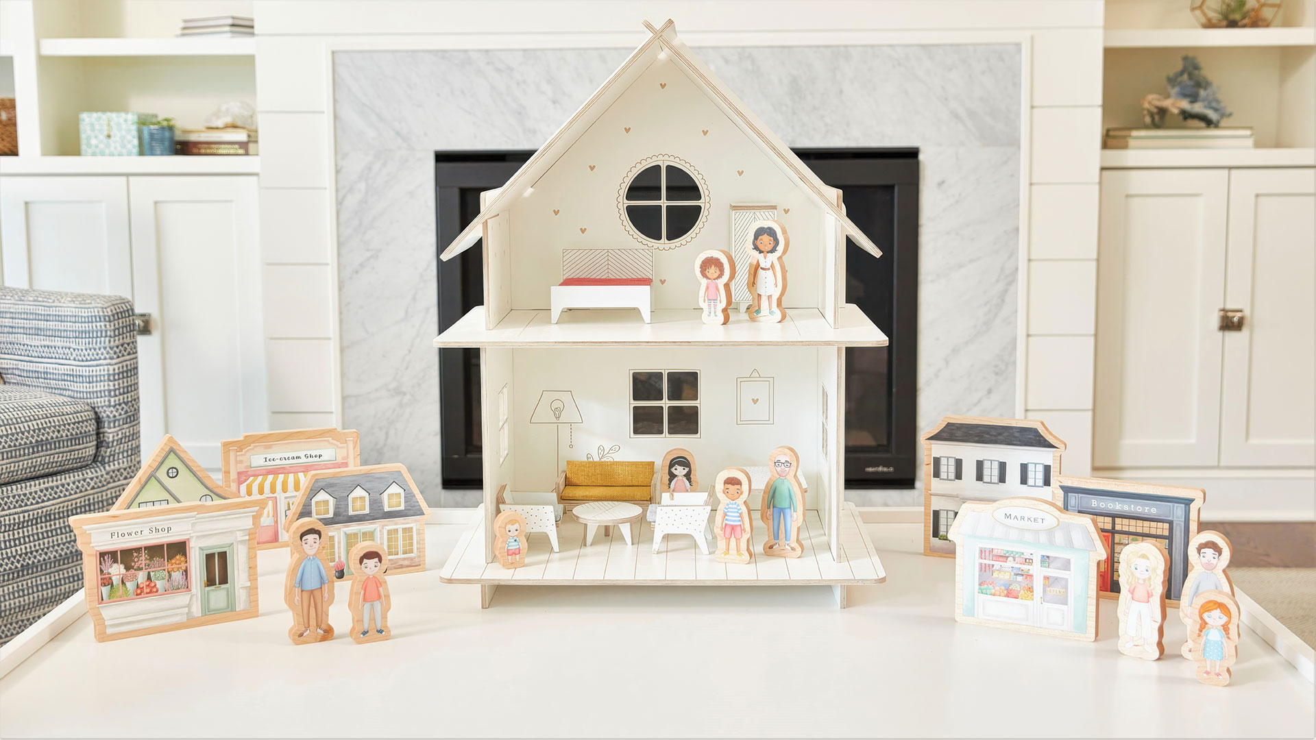 A Kith + Kin Co. dollhouse with customizable figurines comes in three distinctive designs: Cape Cod, Colonial and Tudor.