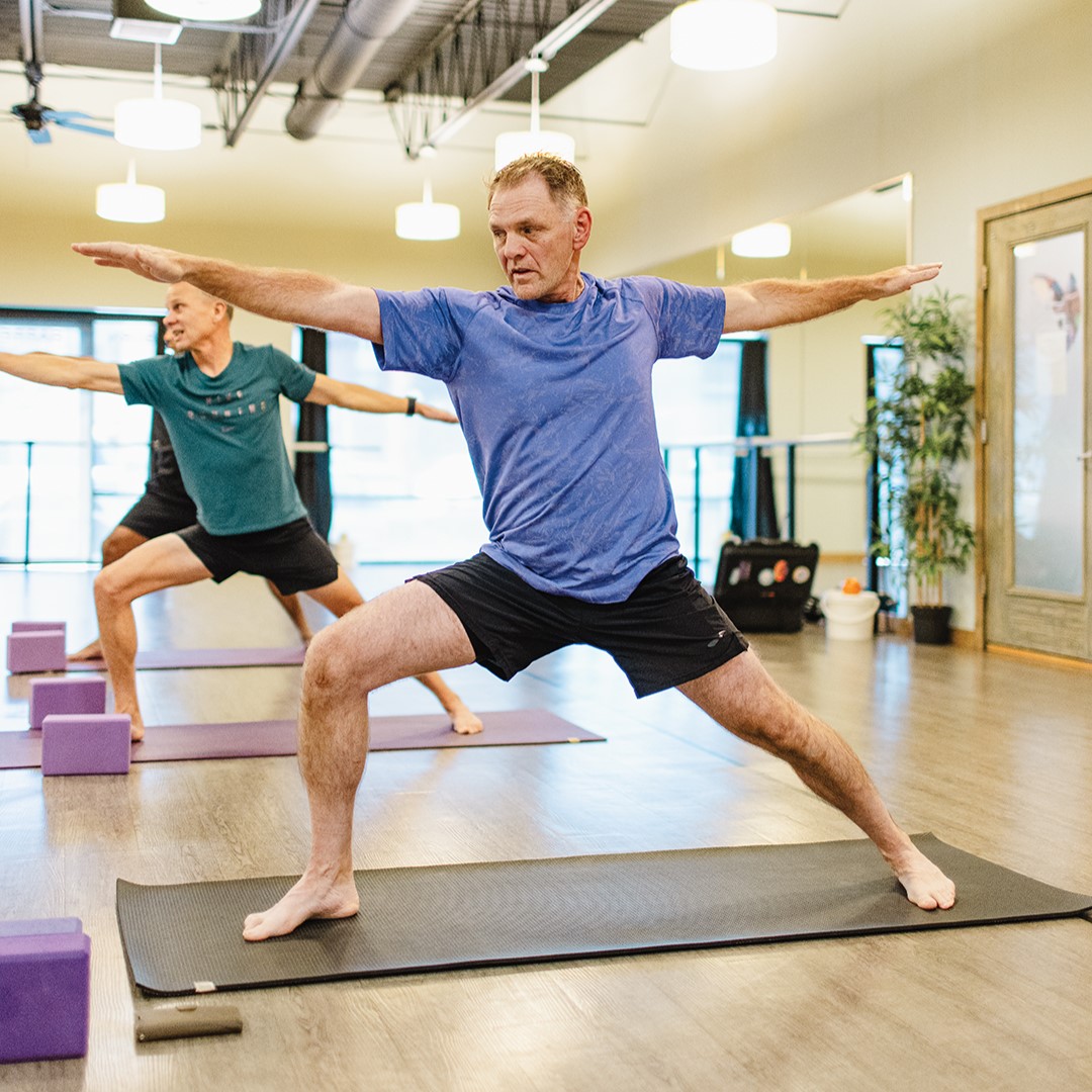 John Buckentine demonstrates the Warrior II pose, also known as the Virabhadrasana II.