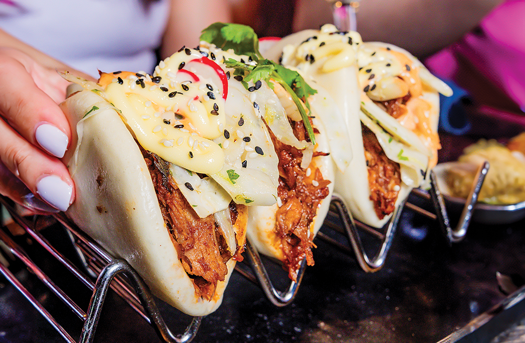 Puttshack puts an Asian fusion spin on bao with its Nashville Hot Bao Buns. Fried chicken is marinated with cayenne and served with chipotle aioli and rainbow slaw.