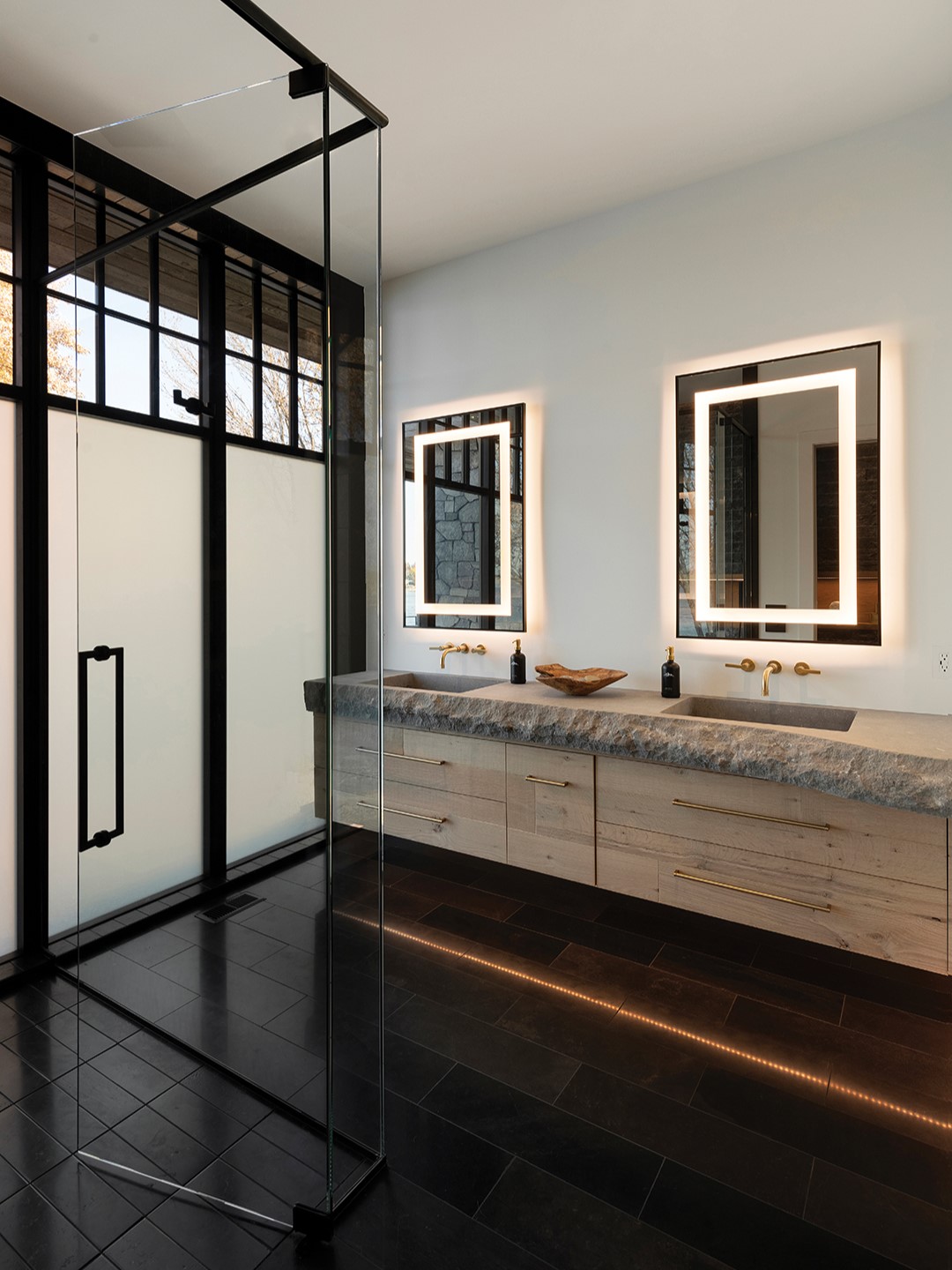 Discreet baseboard lighting is a sophisticated way to illuminate a bathroom, providing guidance and ambiance during nighttime hours.