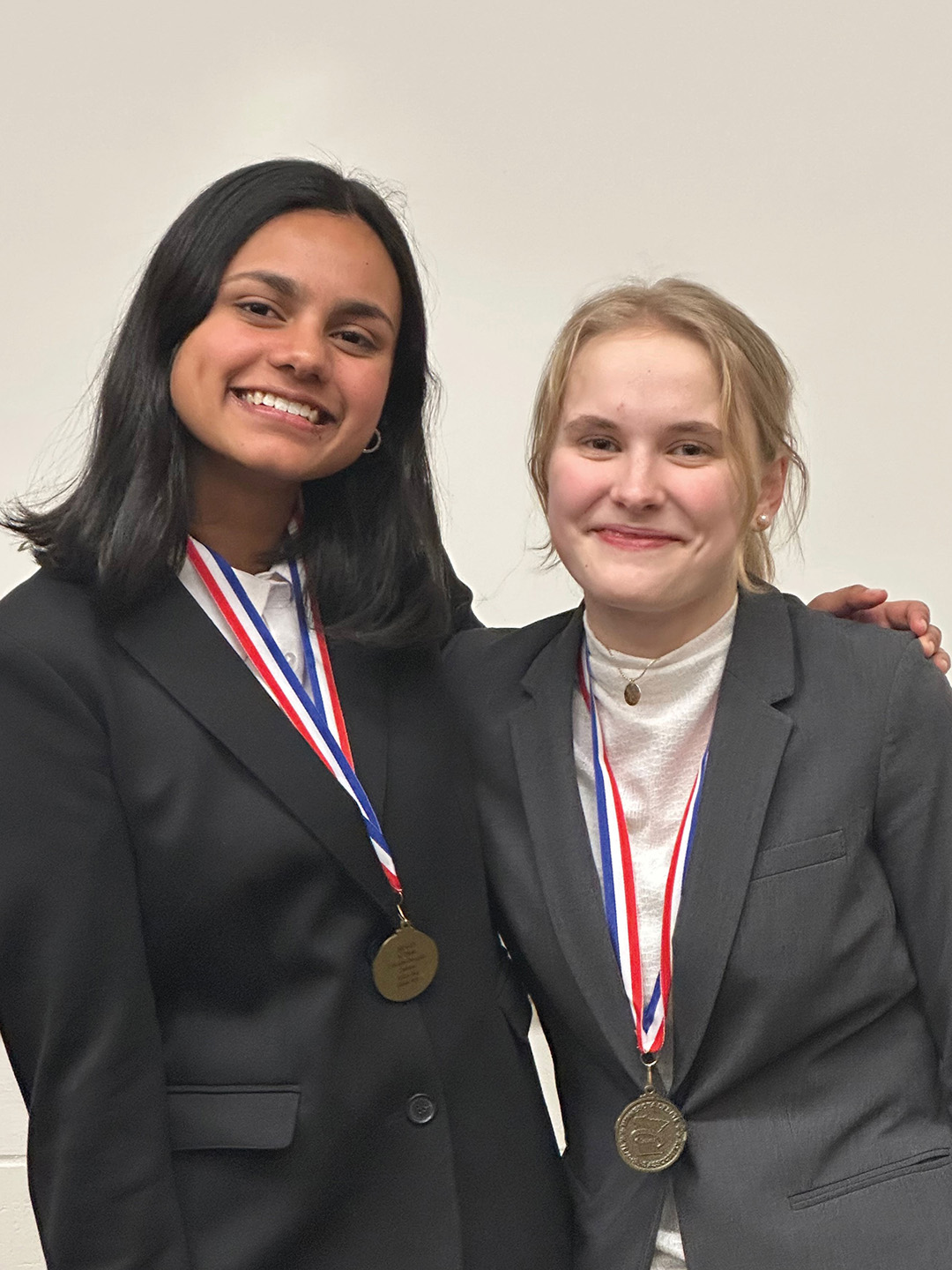 Aditi Jha and Valerie Schmitt at the Debate State Tournament finals in 2025.