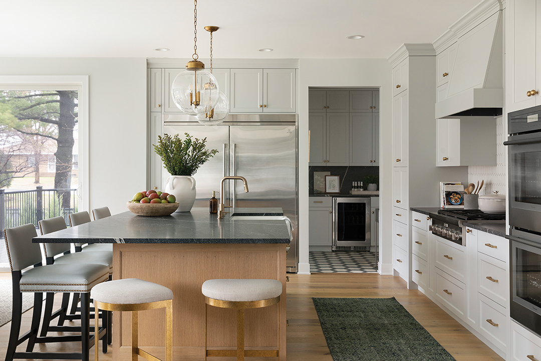 In contrast, the primary residence’s kitchen is white with gold accents.