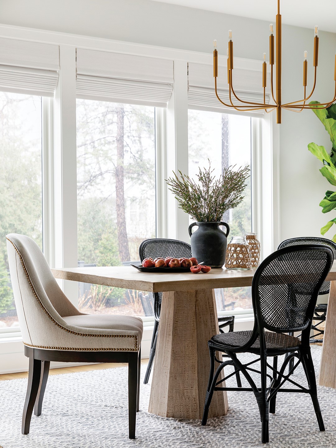 In the primary residence, a smaller dining table supports quieter, everyday moments while the lake home embraces its role as a retreat with a larger table meant for entertaining and shared meals.