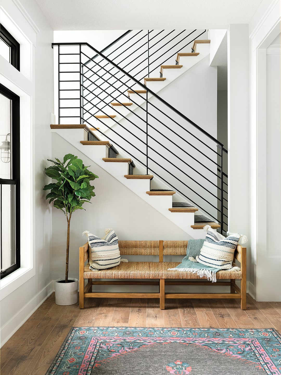 The lake home’s entryway was designed with durability and space in mind. Large foyers make an excellenet drop zone for unloading luggage and groceries. “When designing a lake house, I consider everyday organization and seasonal living needs,” Bhavana Bhimavarapu says.