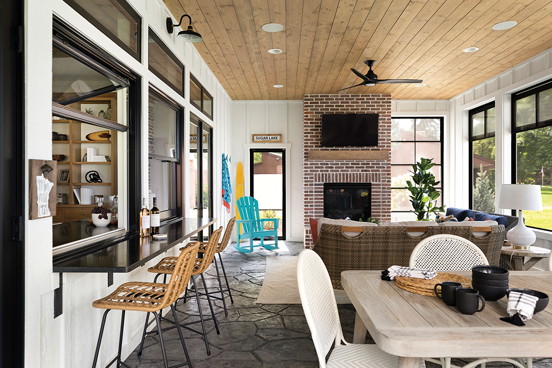 The lake home’s living areas were designed with materials and finishes that hold up to high-traffic, sandy-feet environments. “All indoor upholstery features Crypton-grade fabrics,” Bhavana Bhimavarapu says. “Many of the outdoor pieces are rated for all-weather use to ensure they stand the test of time. For the flooring, we selected textured tile to improve durability and provide traction after coming in from the lake.” The lake home design details cater to easy, flowing, multiuse spaces. “I incorporated extra comfortable and cozy elements,” she says. “I also might find places for fun textures with unexpected, rich colors.” 