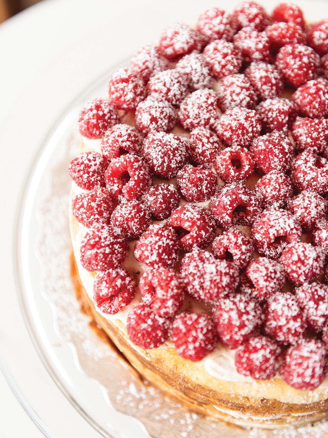 A crêpe cake creation from Bellecour with raspberries and vanilla Chantilly cream.