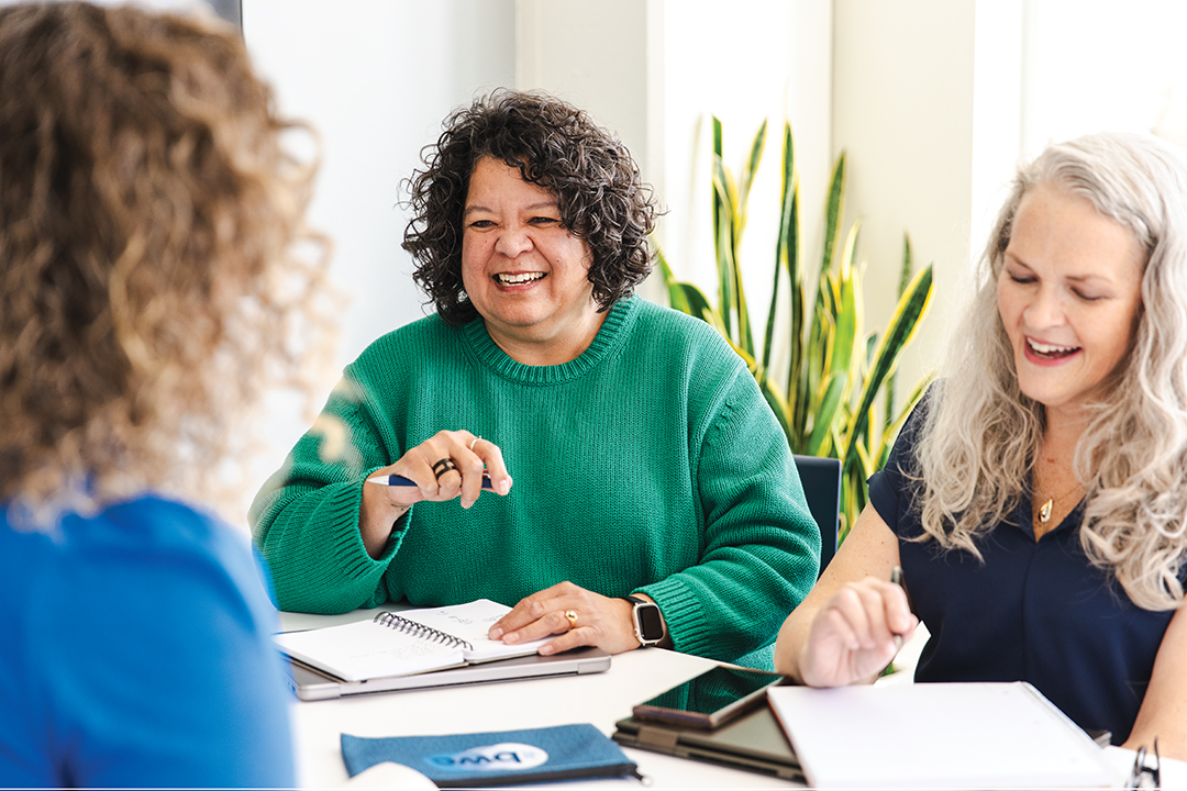 Lani Basa (left) connects with entrepreneurs as she leads a Business Women’s Circle meeting.