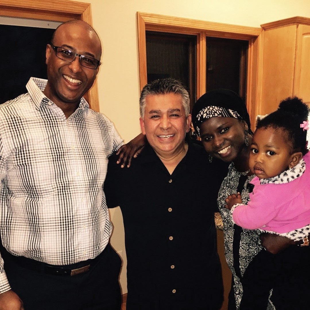 Seck with her husband Mamour (left), her host dad and her daughter, Aisha.
