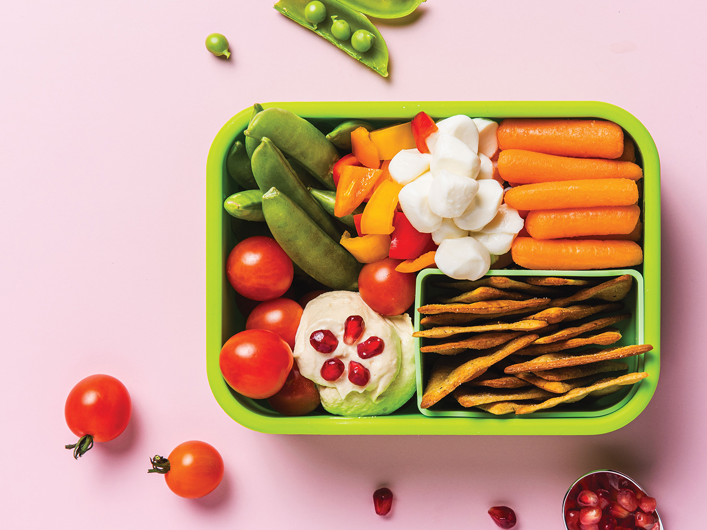 Daniel Green removes the stress from lunch prep with simple and wholesome recipes such as fruits and vegetables with Simple Creamy Hummus With Pomegranate Jewels.