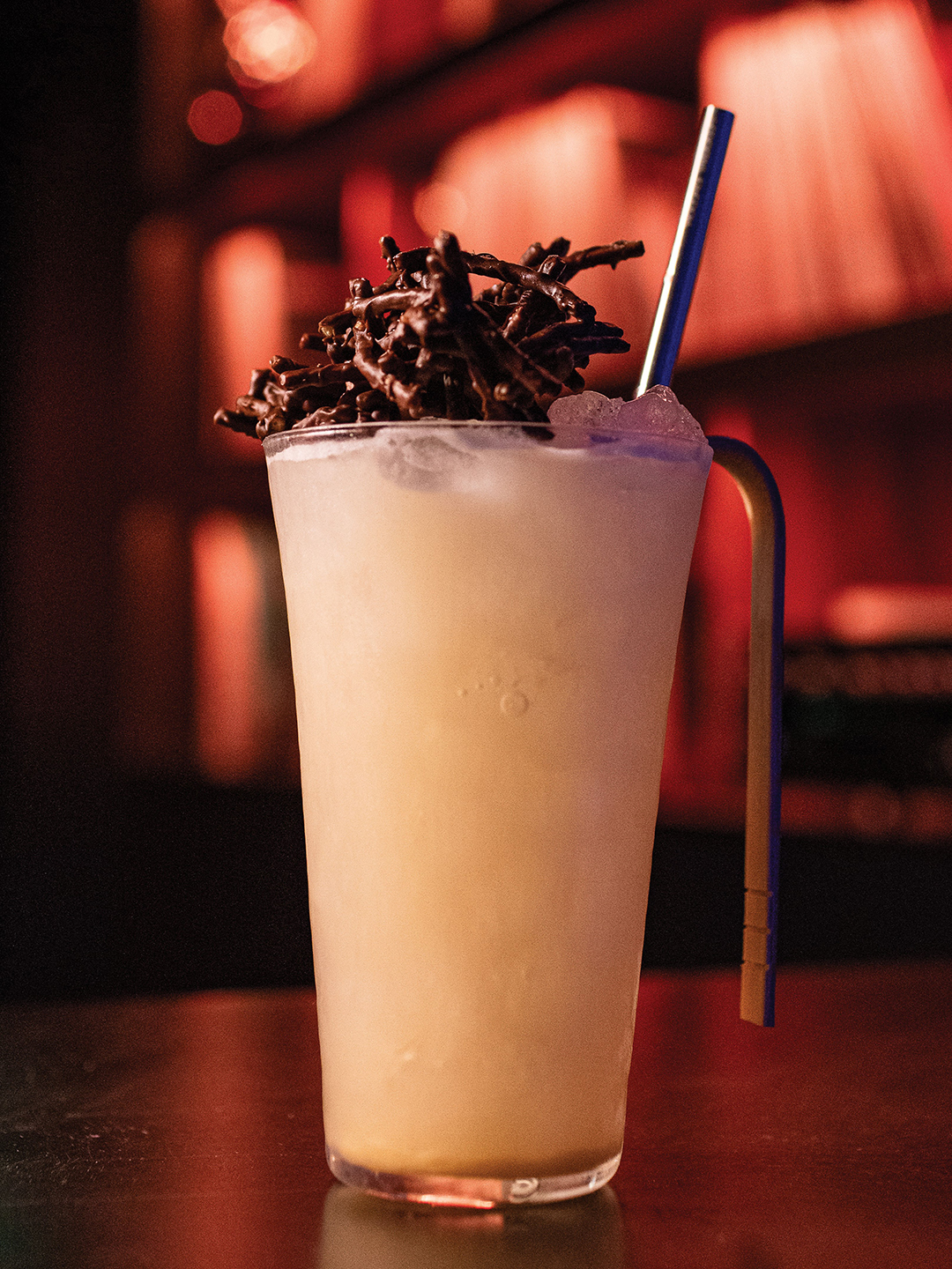 The Haystack is a cocktail with lime, rum, summer orange sake and crispy noodle orgeat.