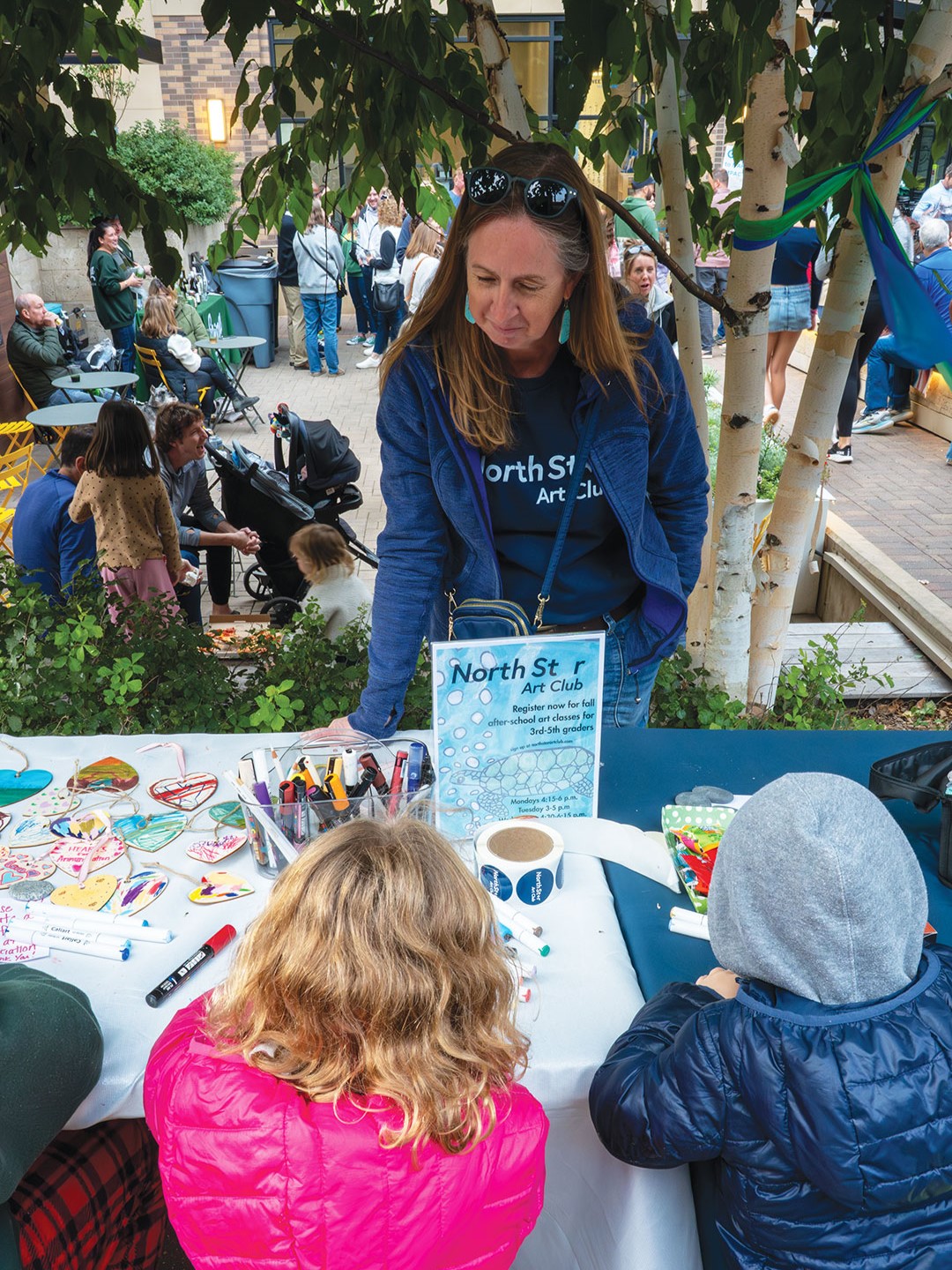 Liz Genrich is an art teacher at North Star Art Club. Genrich has 25 years of teaching experience and is seen here at North Star’s table during the 50th & France Egg Hunt event at Nolan Mains Plaza.