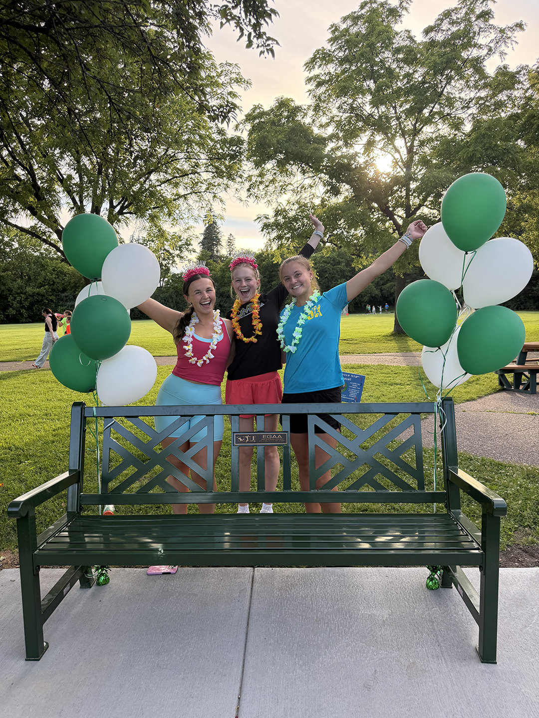 The Edina Girls Athletic Association Run Team celebrates 10 years with a donated park bench.