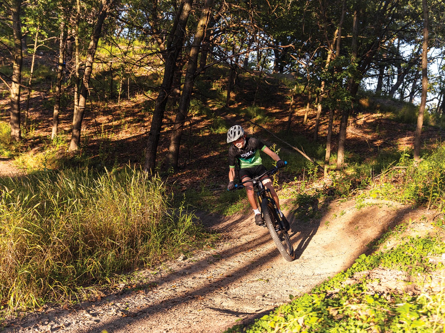 Corban Kass and Liam Kirvida of the Edina Cycling Team ride the trails at Braemar Park.