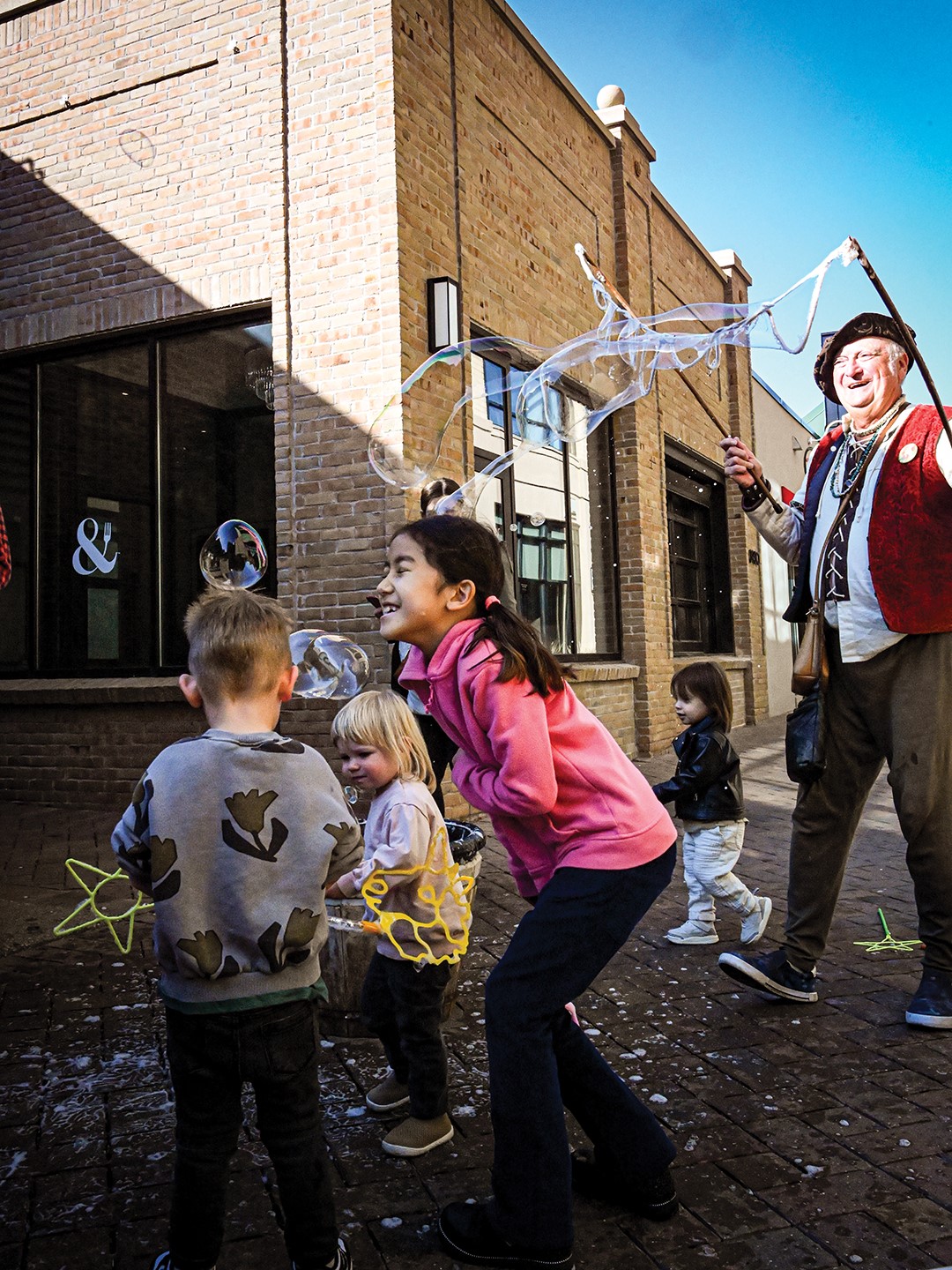 Fall Fest kids playing with bubbles